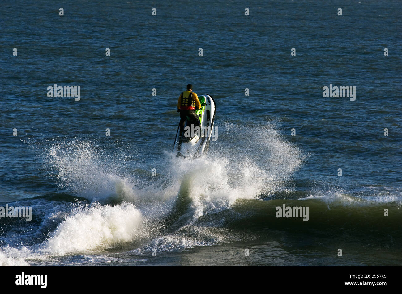 A jet ski riding through the waves off Sandown beach on the Isle of