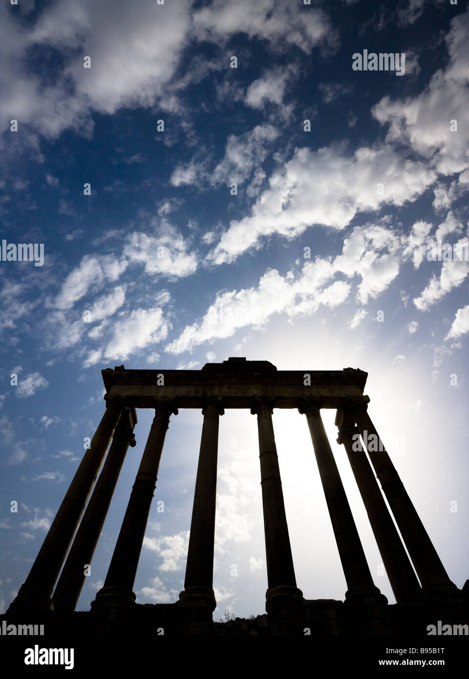 Roman ruins in Rome Italy with a slightly cloudy sky Stock Photo