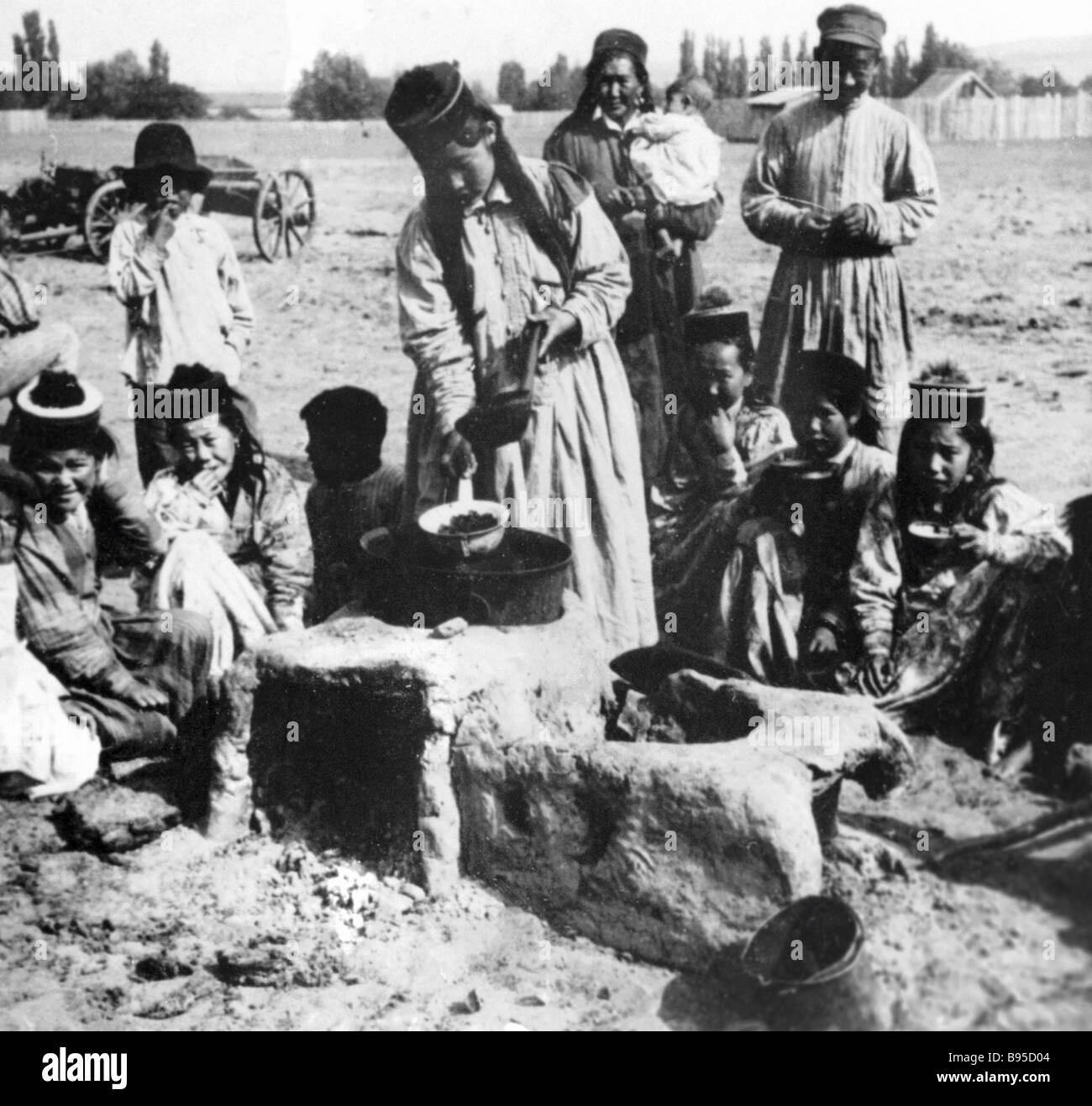 A Kalmyk family having dinner Stock Photo Alamy