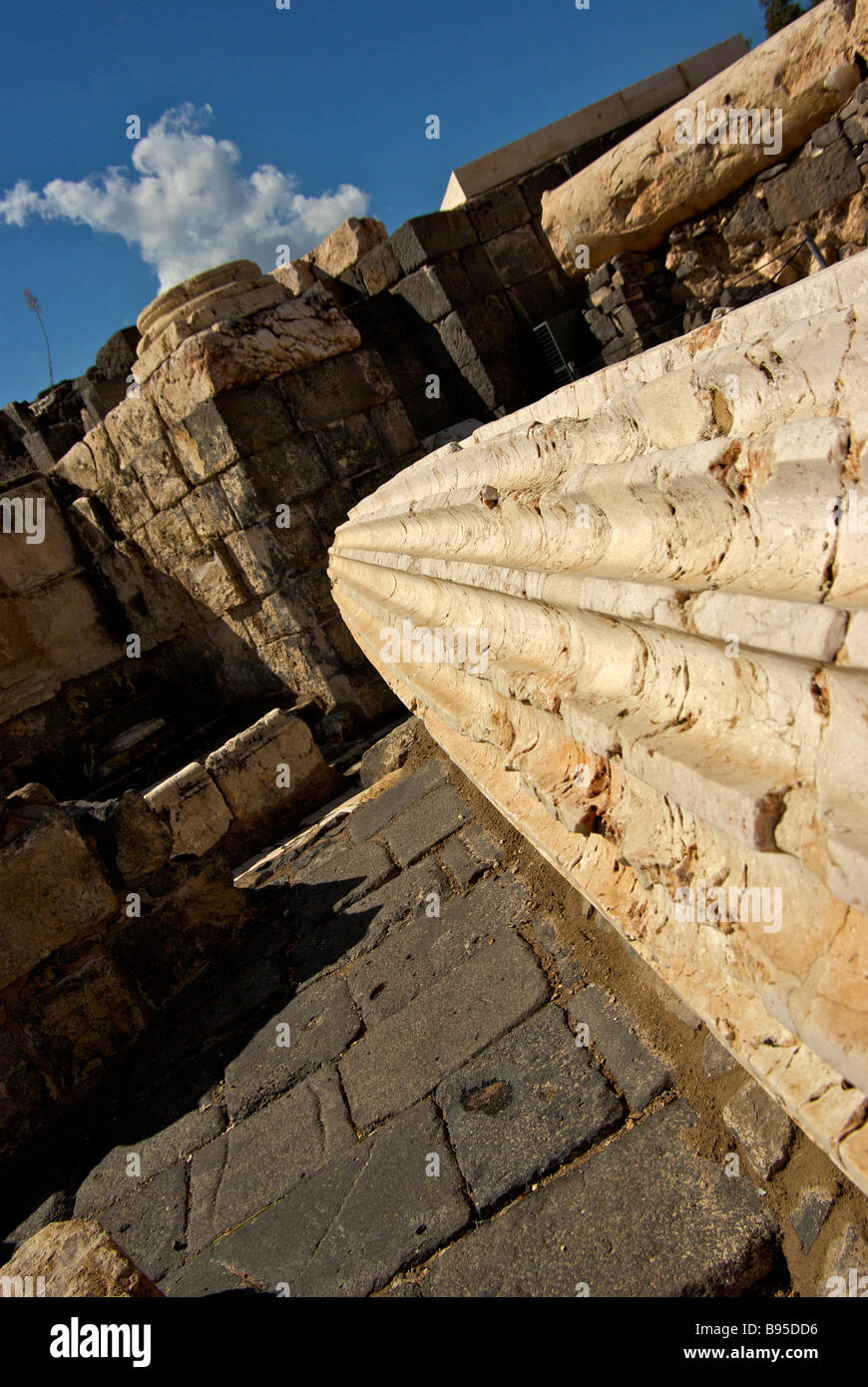 Earthquake toppled building columns debris ruins and upheaved floors in archaeological excavation site at Bet She an Stock Photo