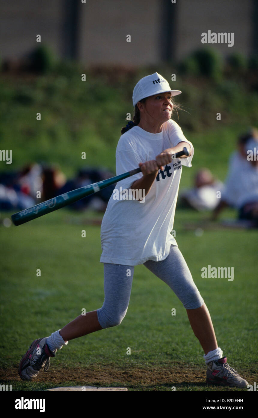 England Sport Ball Games Softball Female player at the plate swinging to strike the ball during the World Corporate Games Stock Photo