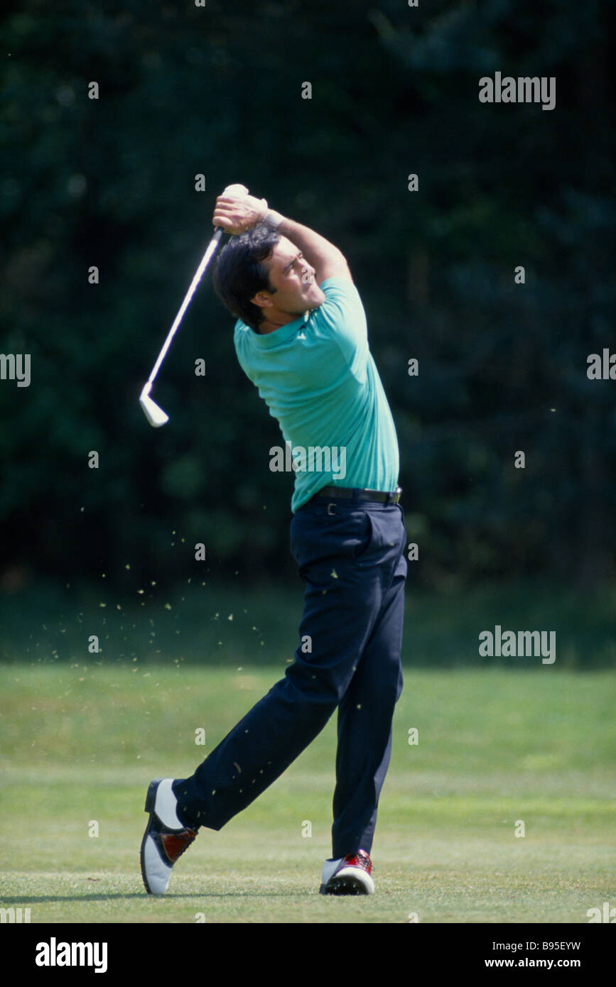 SPORTS Ball Games Golf Spanish Golfer Severiano Seve Balesteros playing the ball from the fairway with an iron Stock Photo