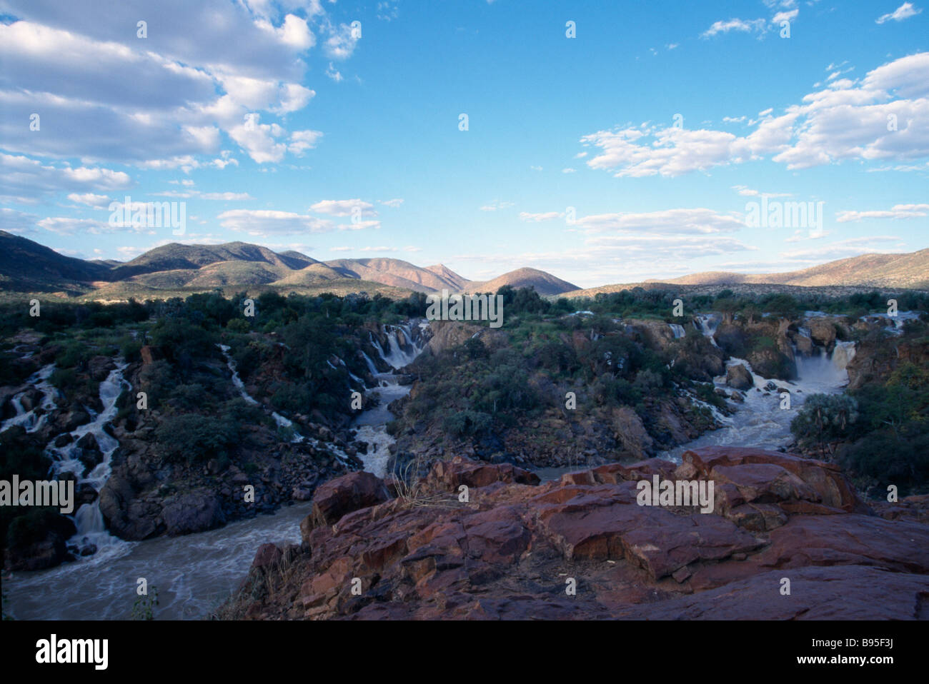 Namibia Cliffs NAMIBIA Epupa Falls Water gushing through rocky cliffs into fast ...