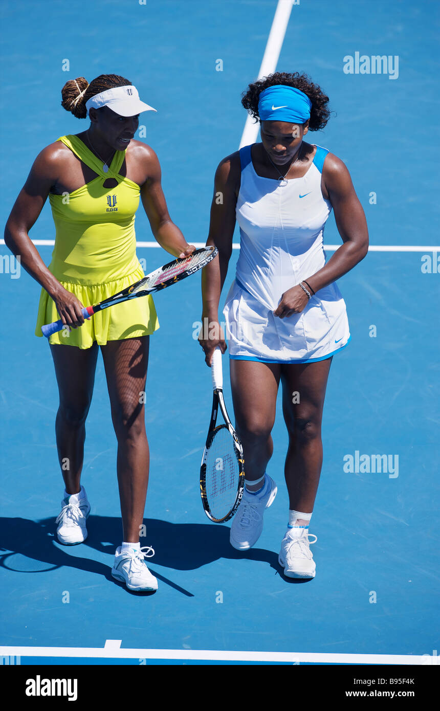 Serena Williams and Venus Williams of the US in a doubles match during the Australian Open Grand Slam 2009 in Melbourne Stock Photo