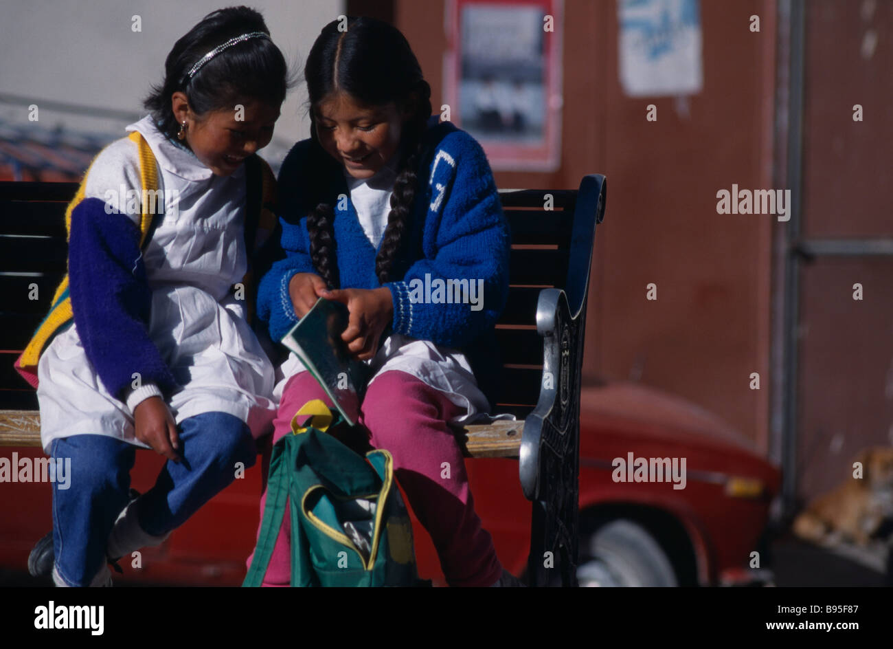 BOLIVIA Potosi School girls share their homework. Stock Photo