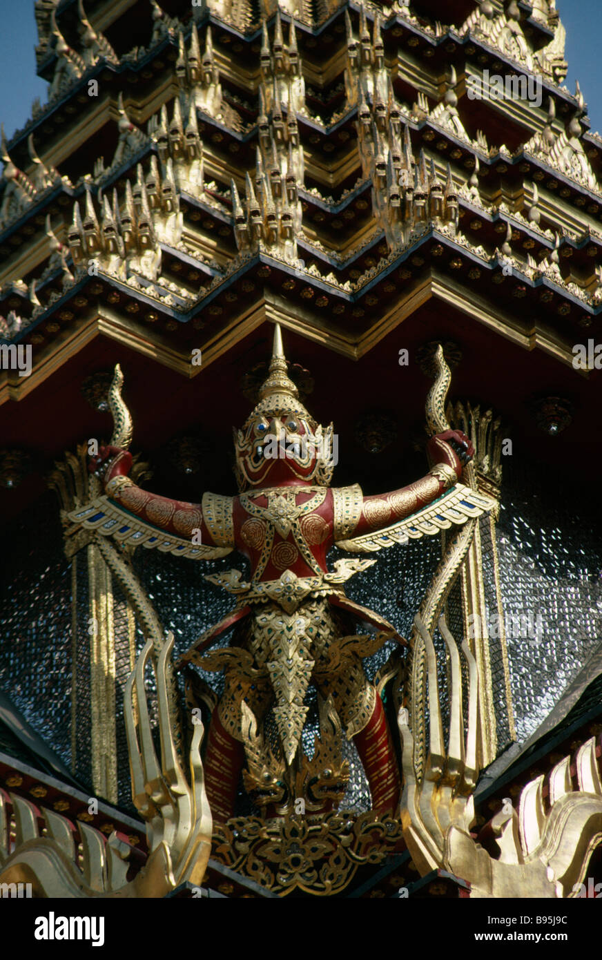 THAILAND Bangkok Grand Royal Palace detail of elaborate gilded roof with winged carved figure Stock Photo