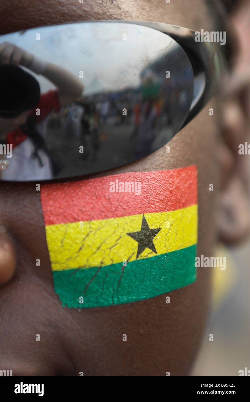 Face painting of Ghanaian flag on Ghana fan in Accra for opening game of Africa Cup of Nations Stock Photo