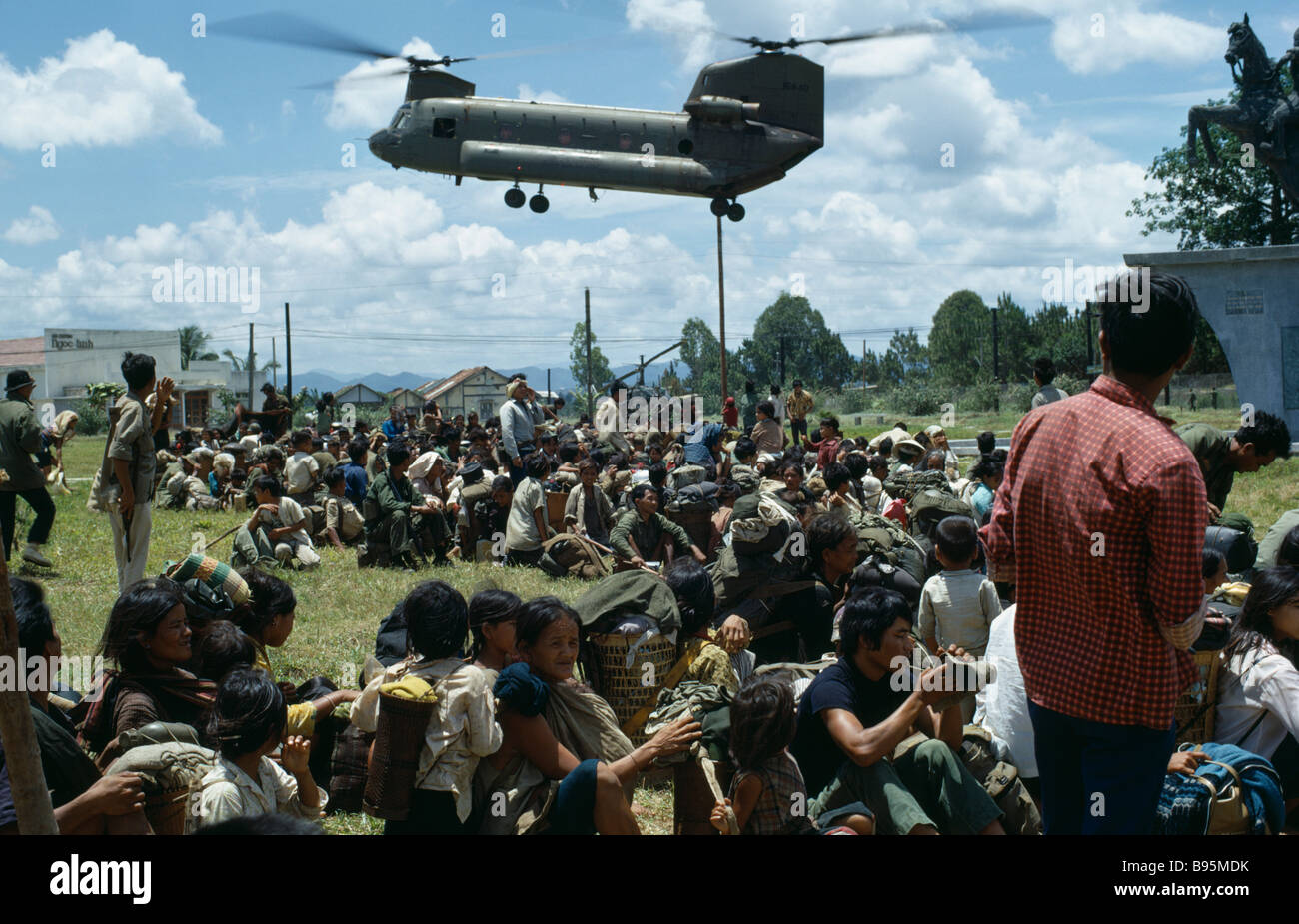 Vietnam War Central Highlands Siege of Kontum Montagnard refugees and United States helicopter evacuation Stock Photo