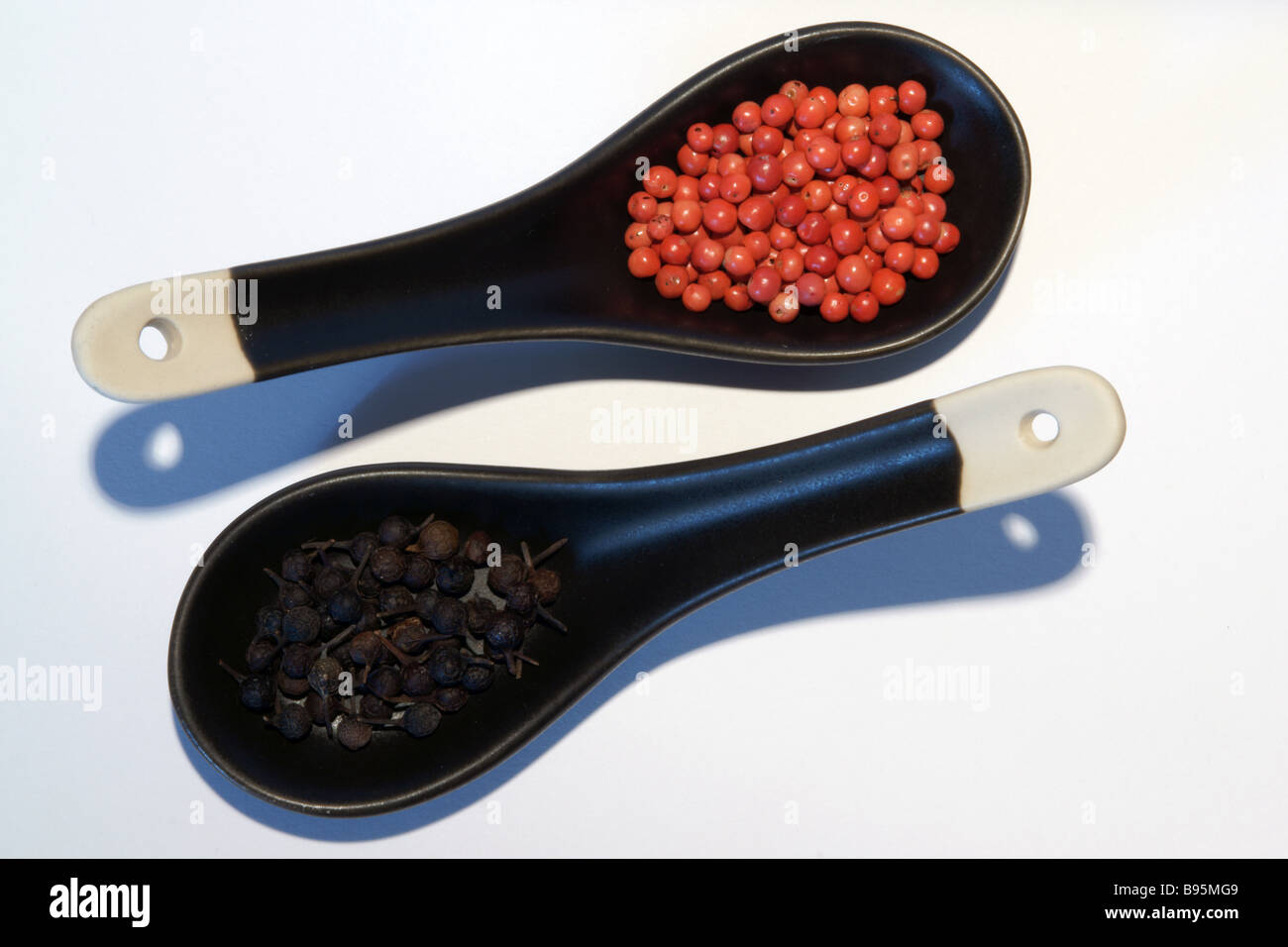 Pink and Cubeb Peppercorns on Chinese Spoons Stock Photo Alamy