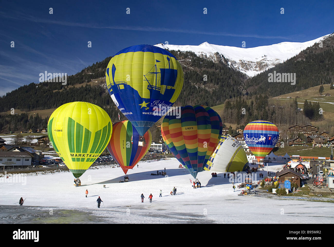Switzerland, Canton de Vaud Chateau d'Oex, Hot Air Balloon Festival.  Colourful balloons taking off from village Stock Photo - Alamy