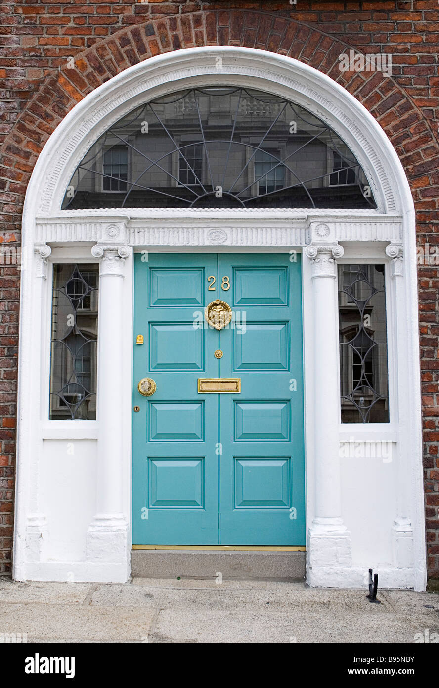 Ireland, Dublin, Georgian doorway near Merrion Square with turquoise painted door and white surround with glass insets. Stock Photo
