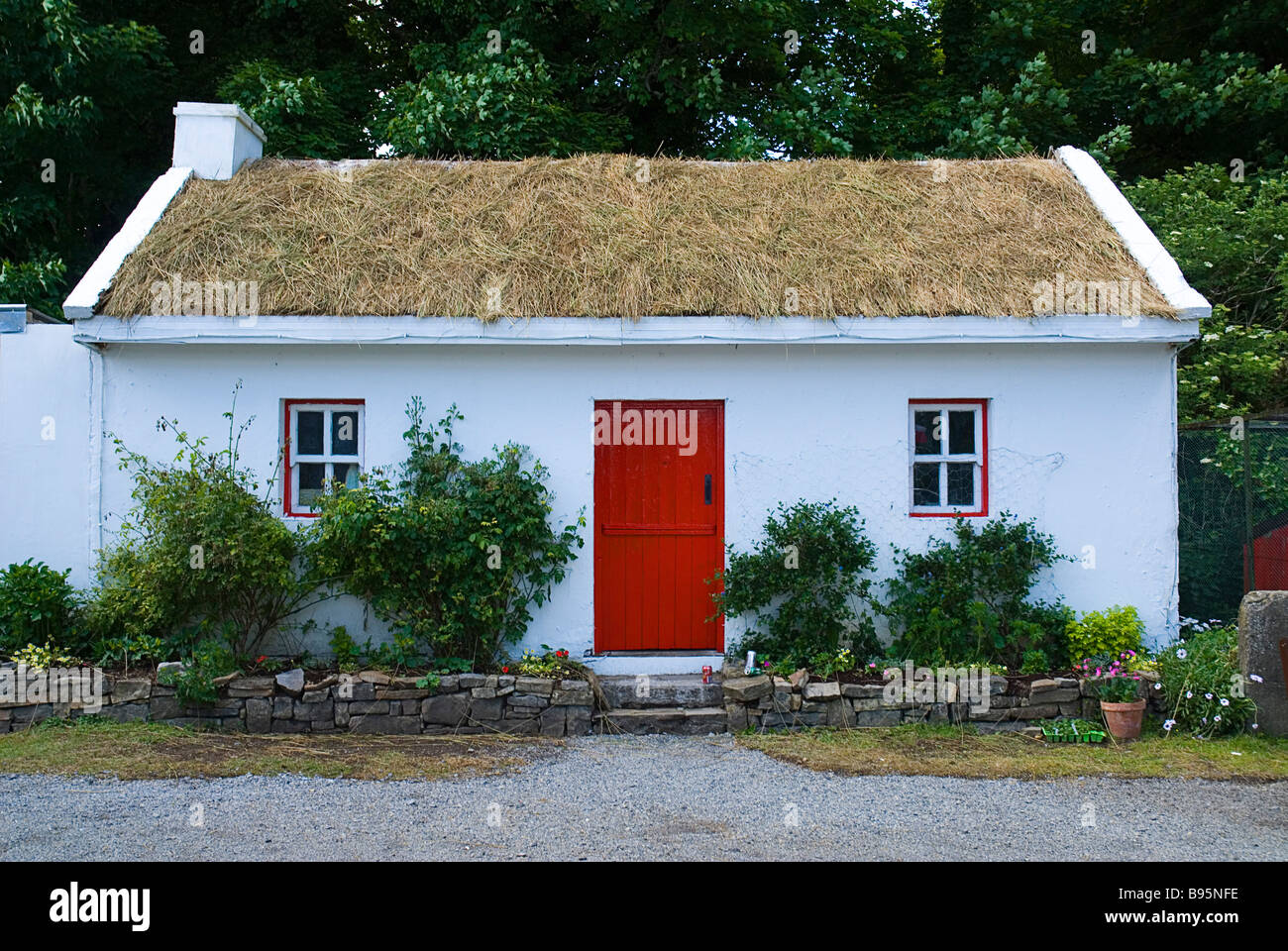 Ireland, County Sligo, Riverstown. White painted cottage at Sligo Folk