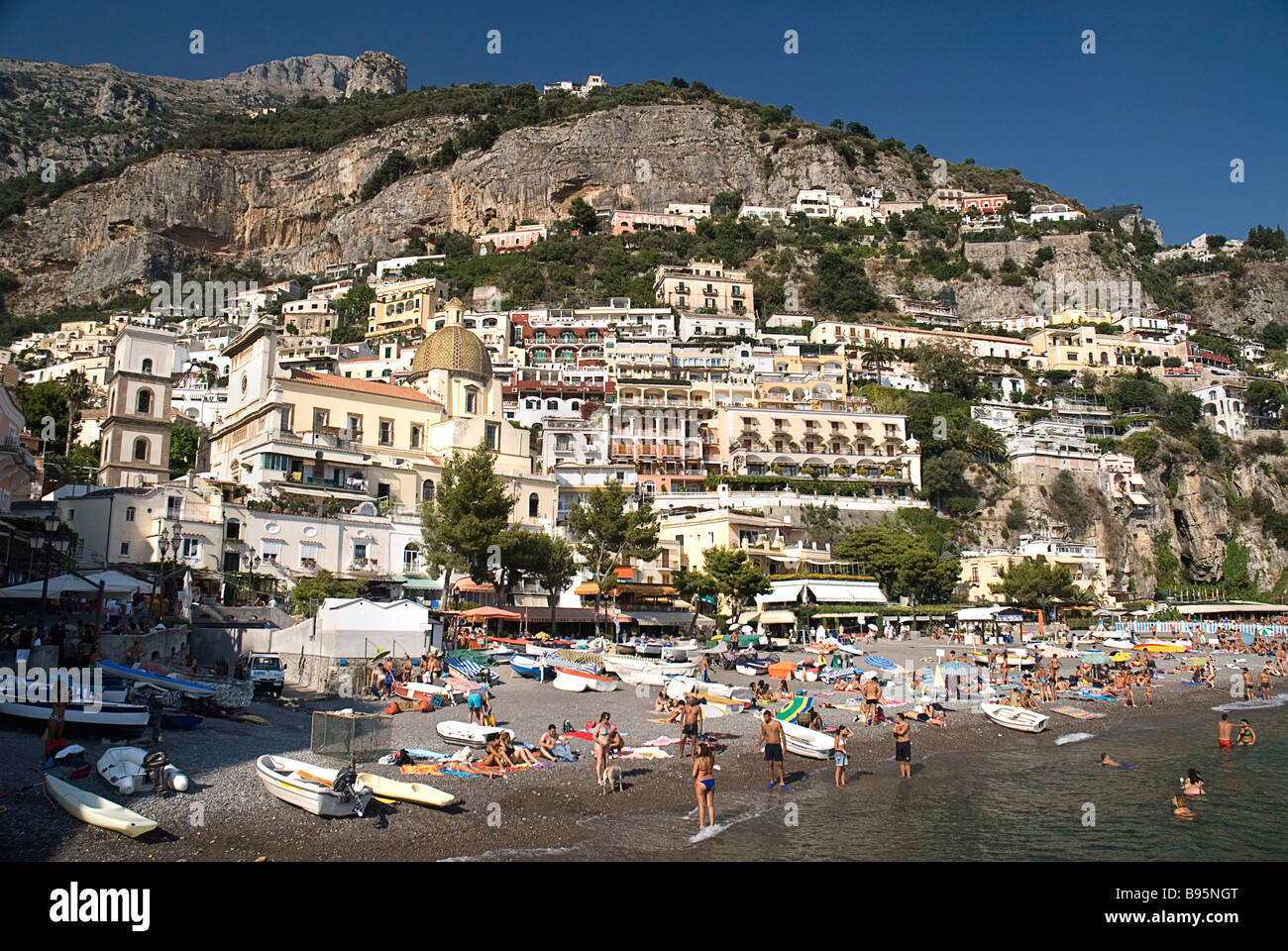 Italy, Campania, Salerno, Positano, Spiaggia Grande beach with central Positano and Church of Santa Maria Assunta behind Stock Photo