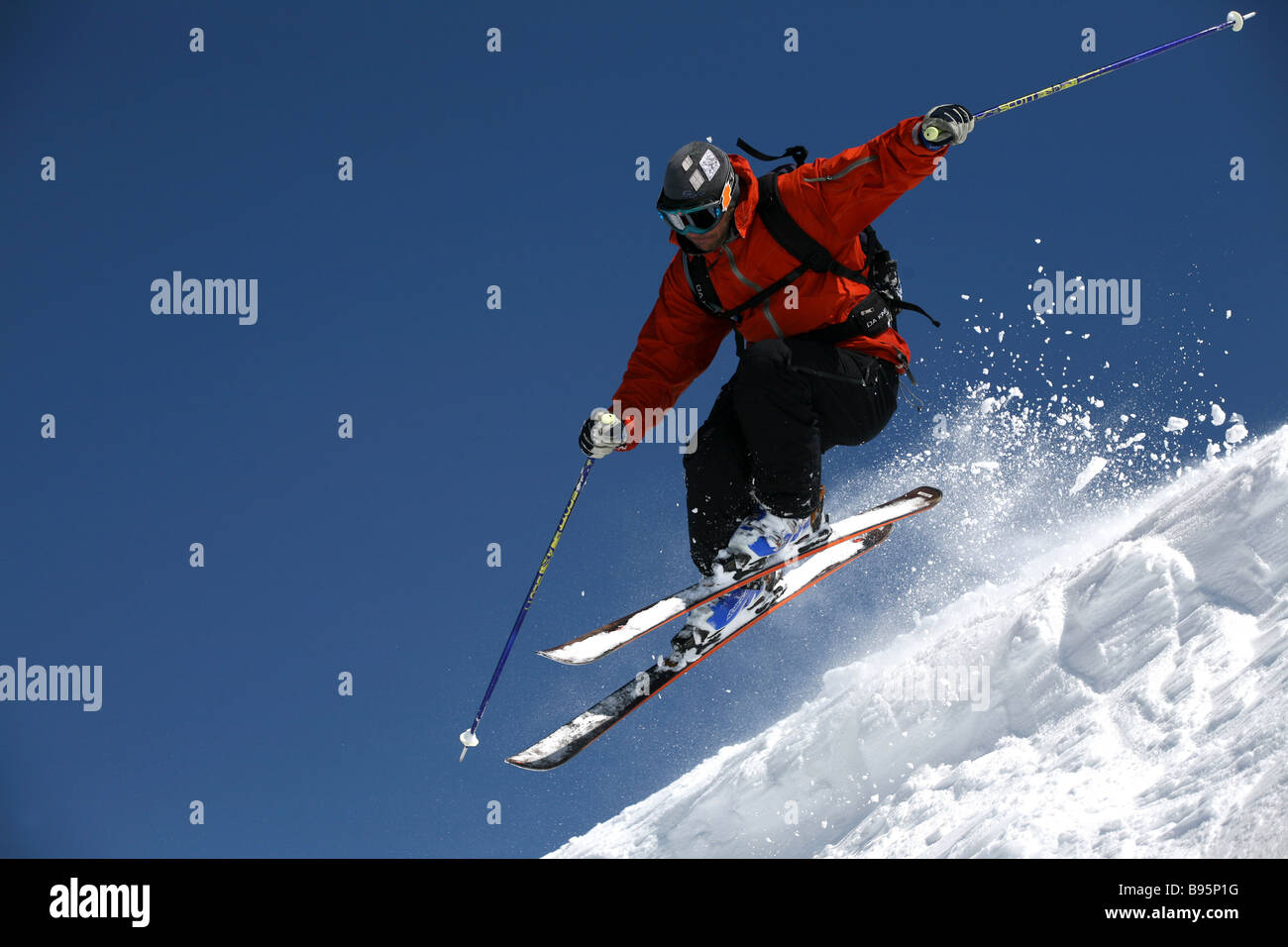 Generic shot of skier at speed in red jacket Stock Photo