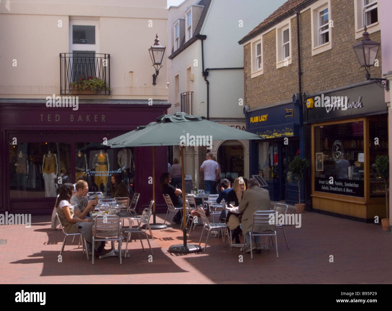 ENGLAND East Sussex Brighton People sat at tables outside café in Dukes Lane. Stock Photo