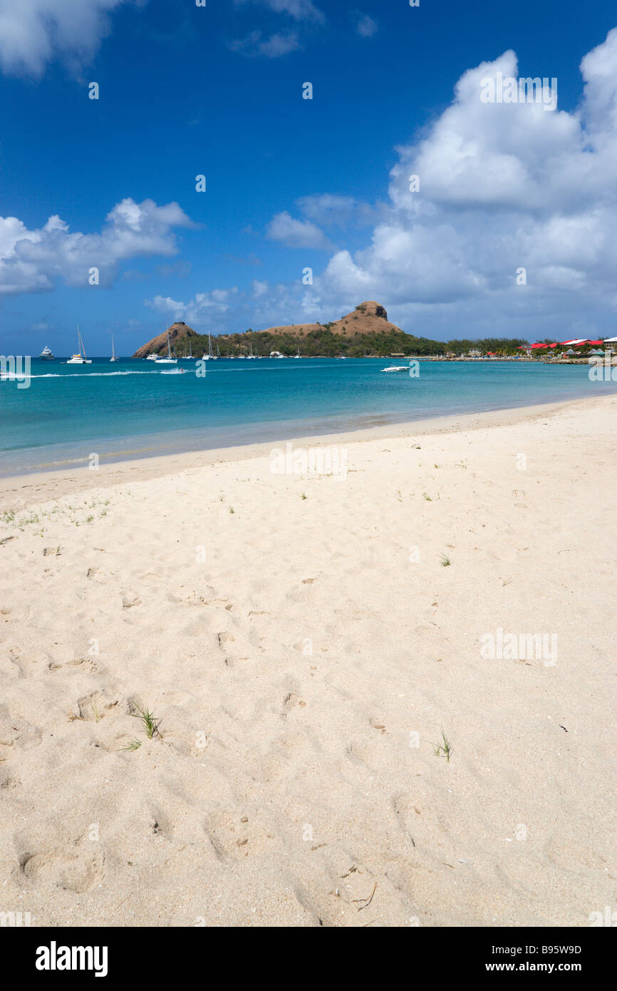 WEST INDIES Caribbean St Lucia Gros Islet Pigeon Island seen from a nearby beach on causeway. Yachts at anchor in Rodney Bay Stock Photo