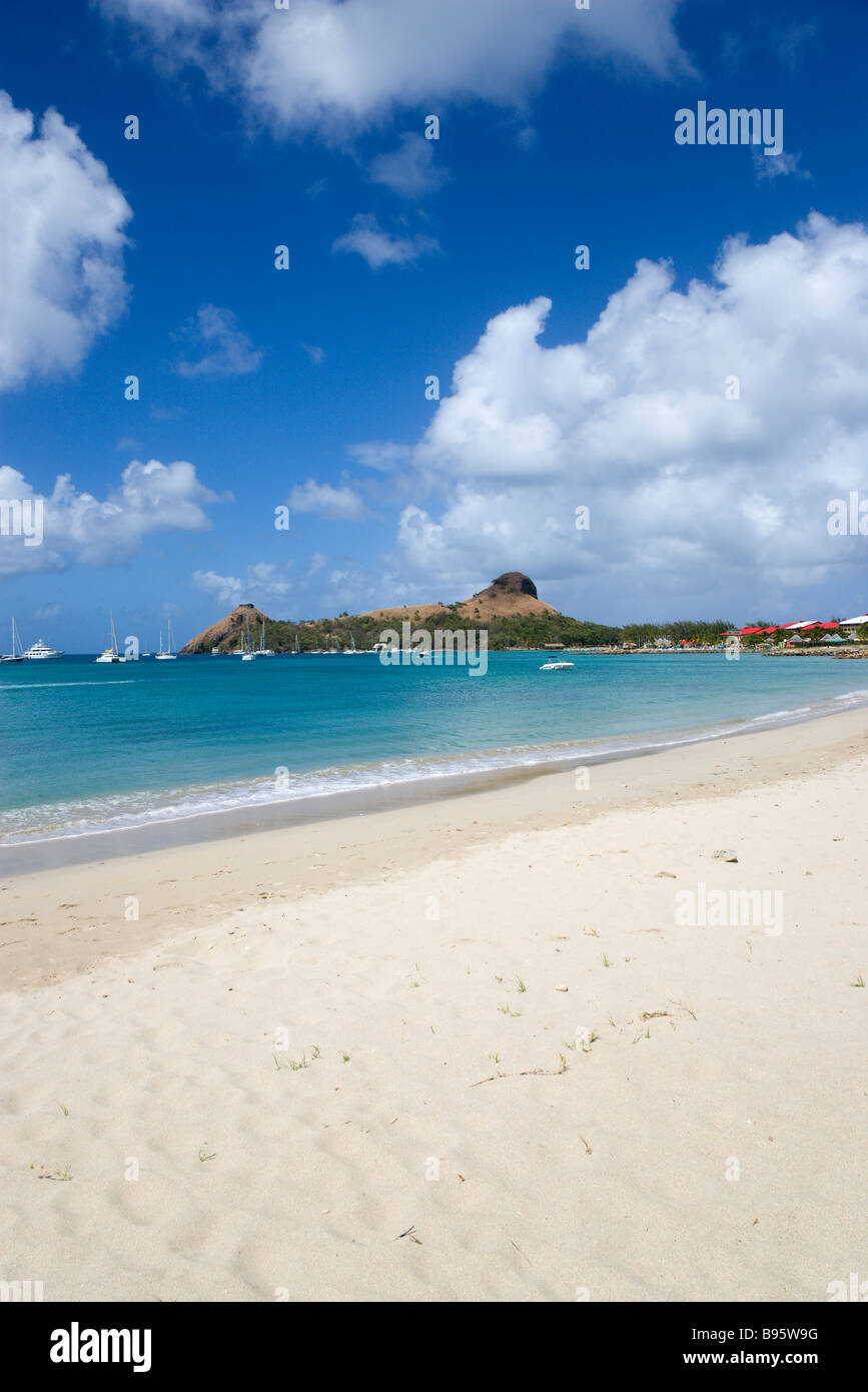 WEST INDIES Caribbean St Lucia Gros Islet Pigeon Island seen from nearby beach on causeway with yachts at anchor in Rodney Bay Stock Photo