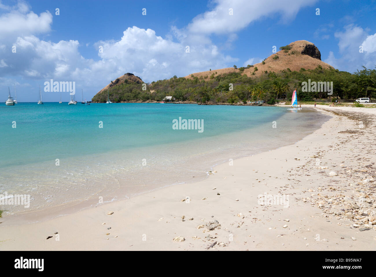 WEST INDIES Caribbean St Lucia Gros Islet Pigeon Island seen from beach on causeway to island. Yachts at anchor. Rodney Bay Stock Photo
