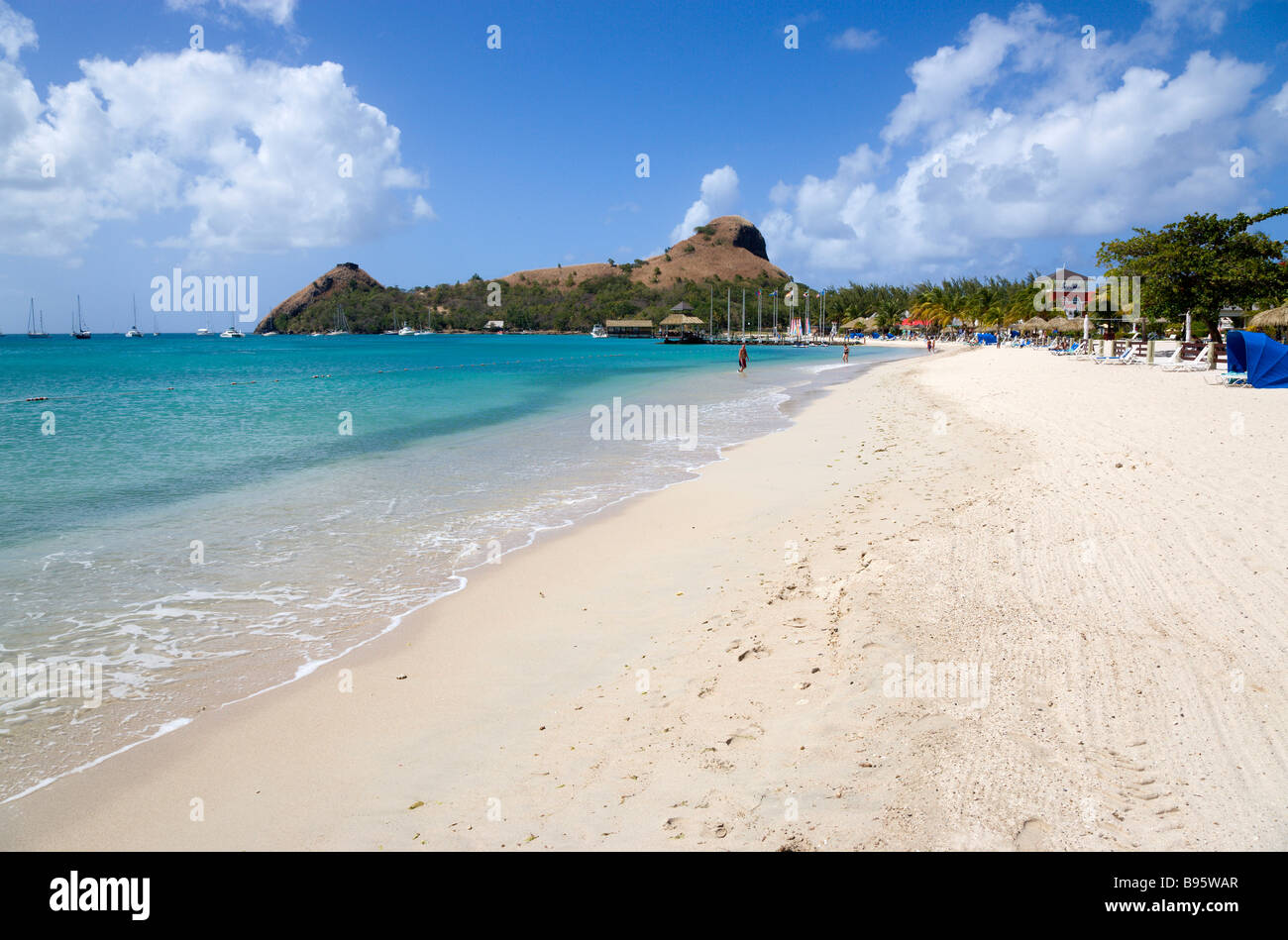 WEST INDIES Caribbean St Lucia Gros Islet Rodney Bay Sandy beach with  people at Sandals Grande St Lucian with Pigeon Island Stock Photo - Alamy