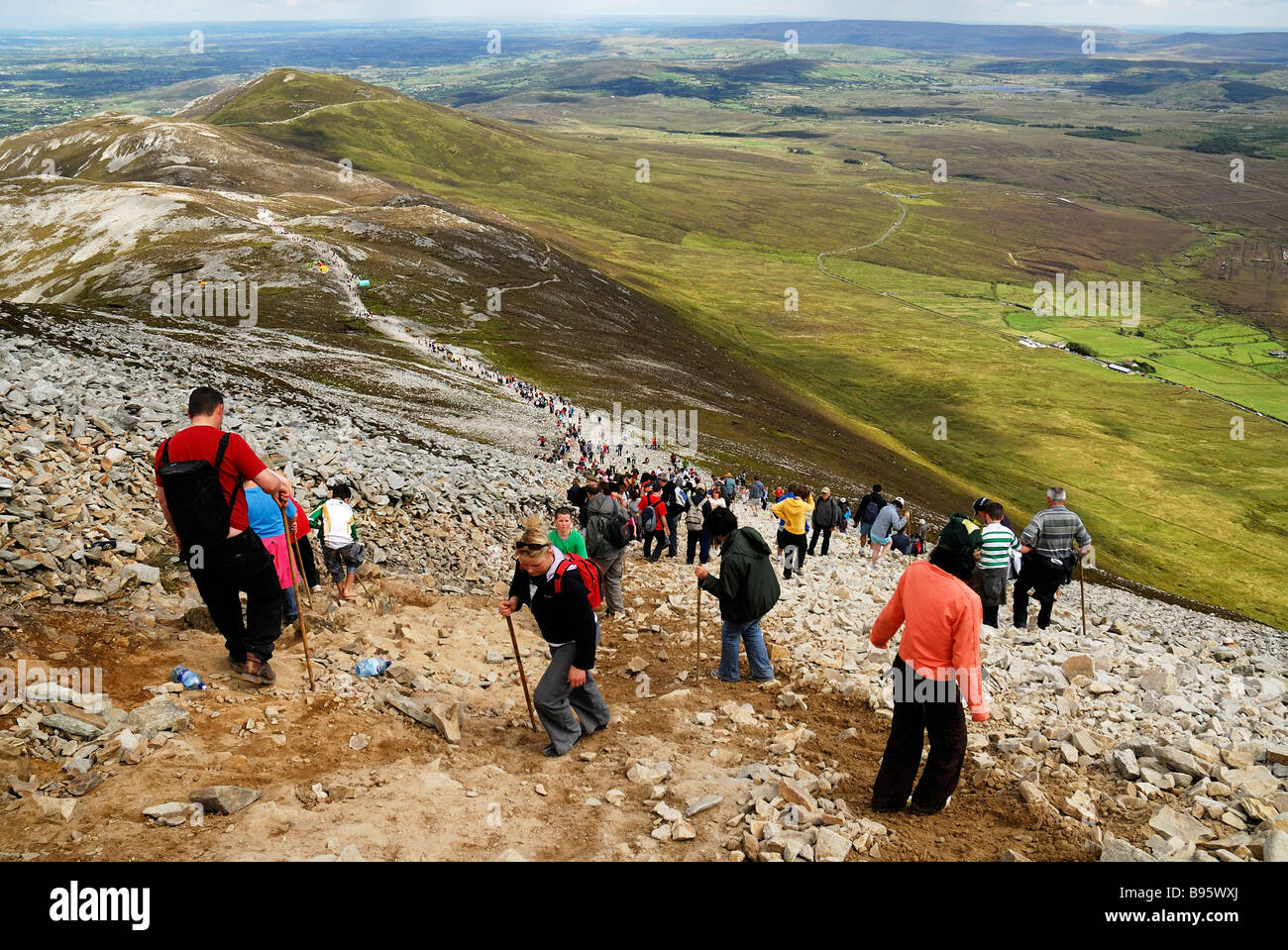 Ireland, County Mayo, Croagh Patrick Mountain. Pilgrims making their way to the mountain top as part of Reek Sunday pilgrimage. Stock Photo