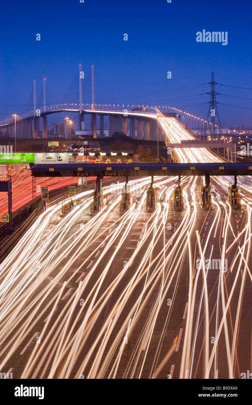 Traffic passing through toll booths at night. Queen Elizabeth II Bridge and Dartford Tunnel, Kent, UK Stock Photo