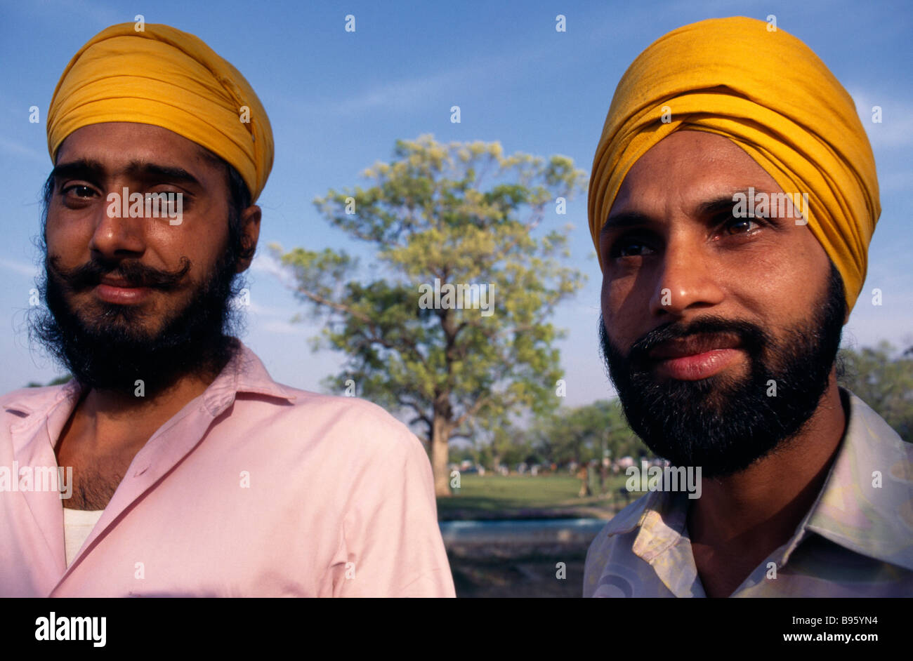 INDIA South Asia Delhi Two Sikh men, head and shoulders portrait