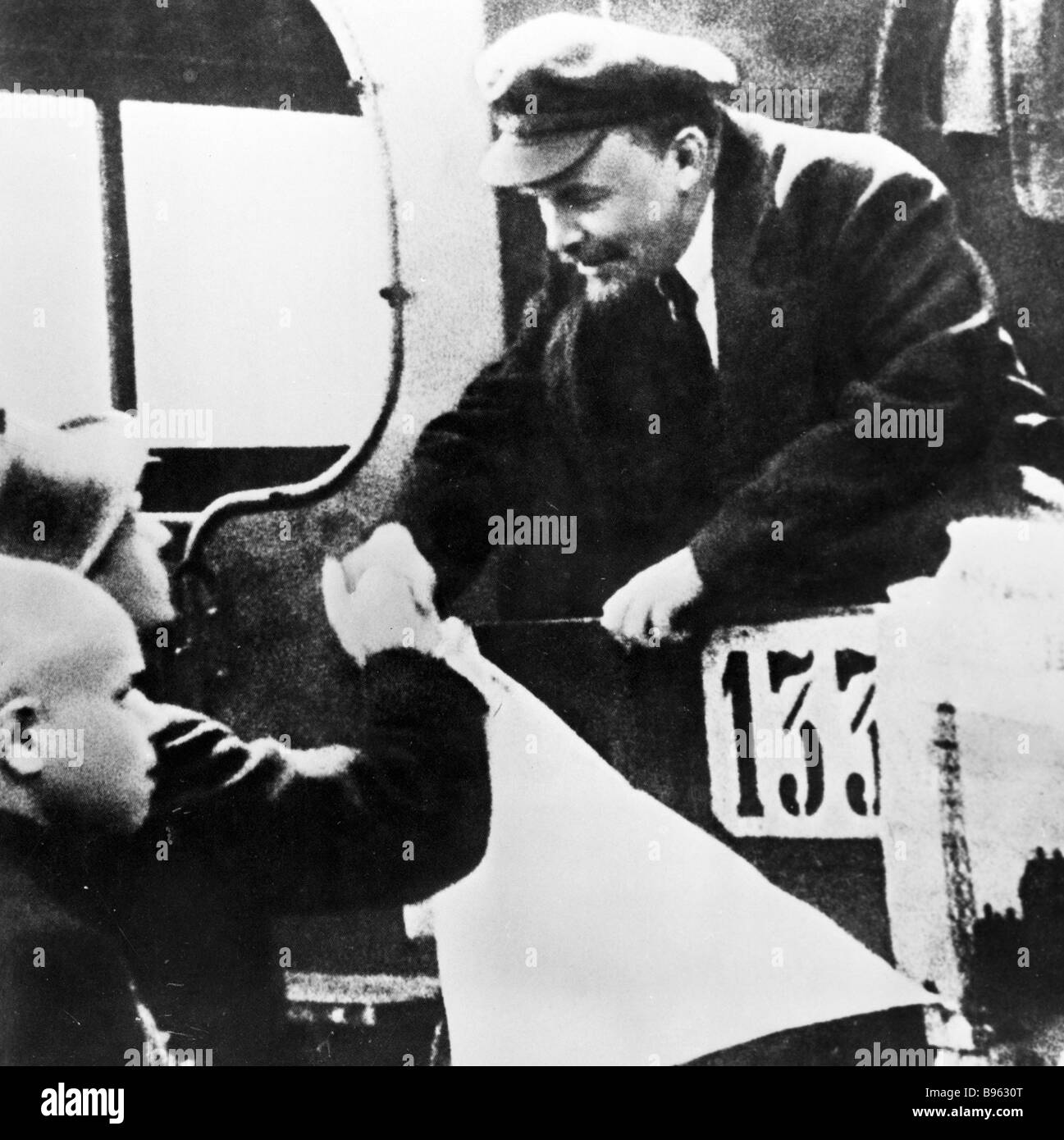 Vladimir Lenin right making his farewells to a troops festival ...