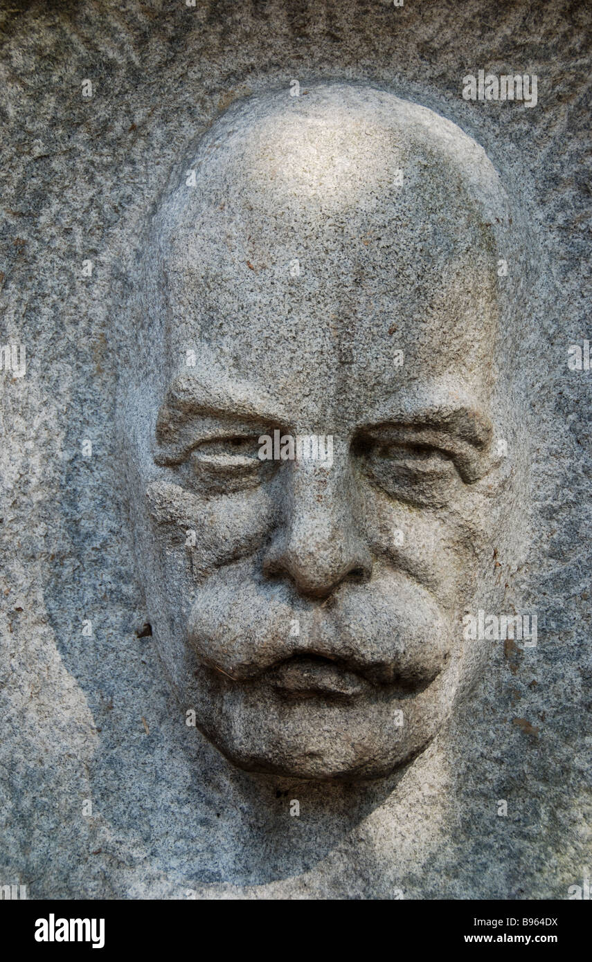 A stone relief sculpture on display in Toronto's Guild Inn depicting the face of Canadian artist and painter Robert Holmes by sculptor John Byers. Stock Photo