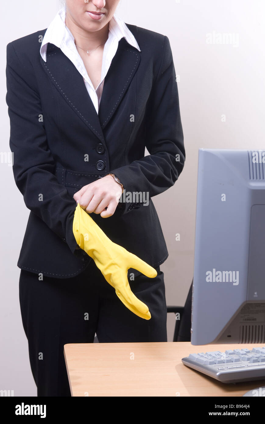Business woman wearing yellow rubber gloves Stock Photo Alamy