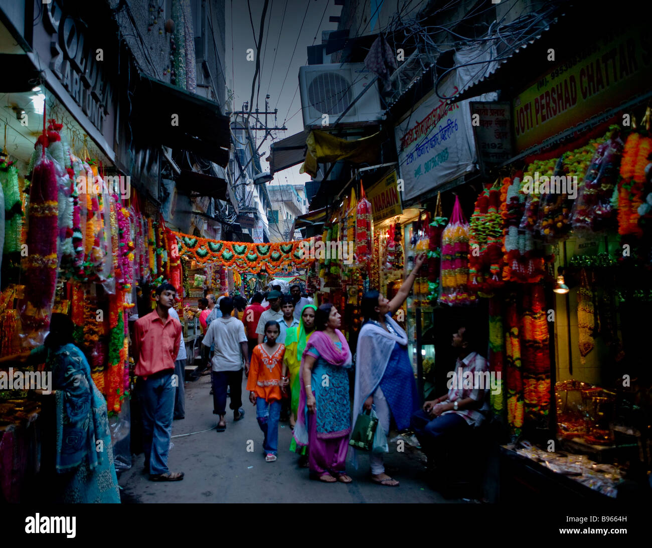 A colourful, busy street market in old Delhi, just off Chandni Chowk Stock Photo