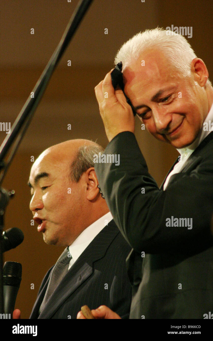 Violinist conductor Vladimir Spivakov right and President of Kyrgyzia
