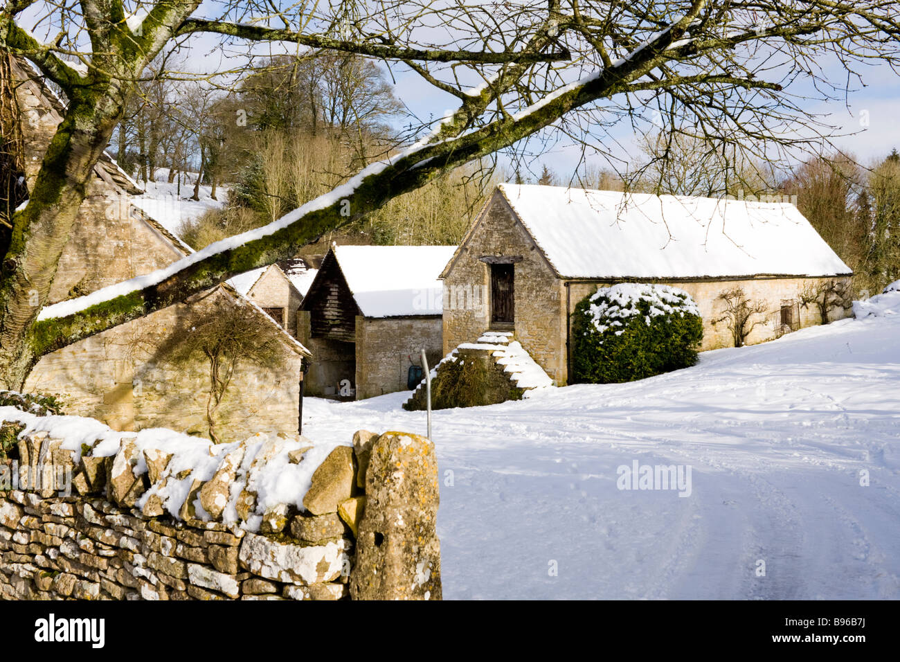 A farmyard in winter snow in the Cotswold village of Duntisbourne Leer, Gloucestershire Stock Photo