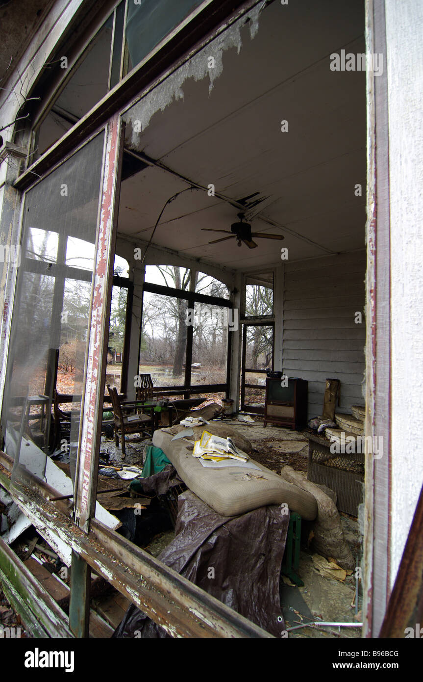 With the windows blown out from a storm and the furniture damaged, a