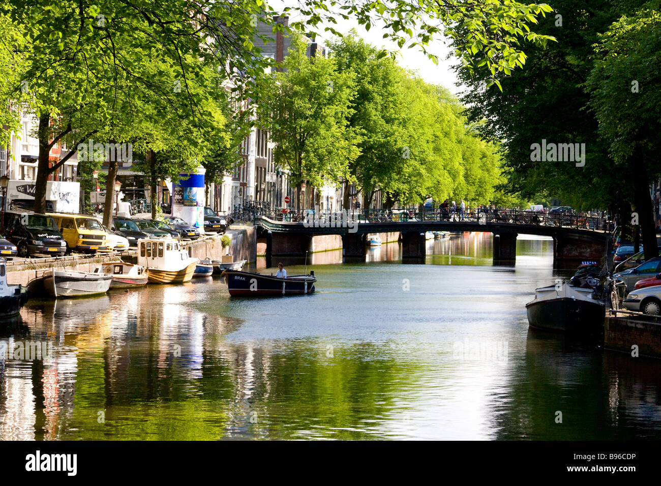 singel canal with barges, boats and bridge Stock Photo
