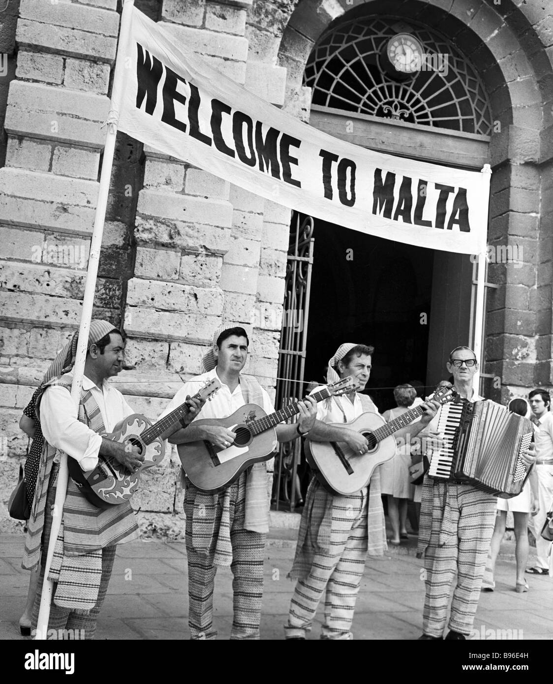 The Maltese in ethnic costumes greeting tourists with songs