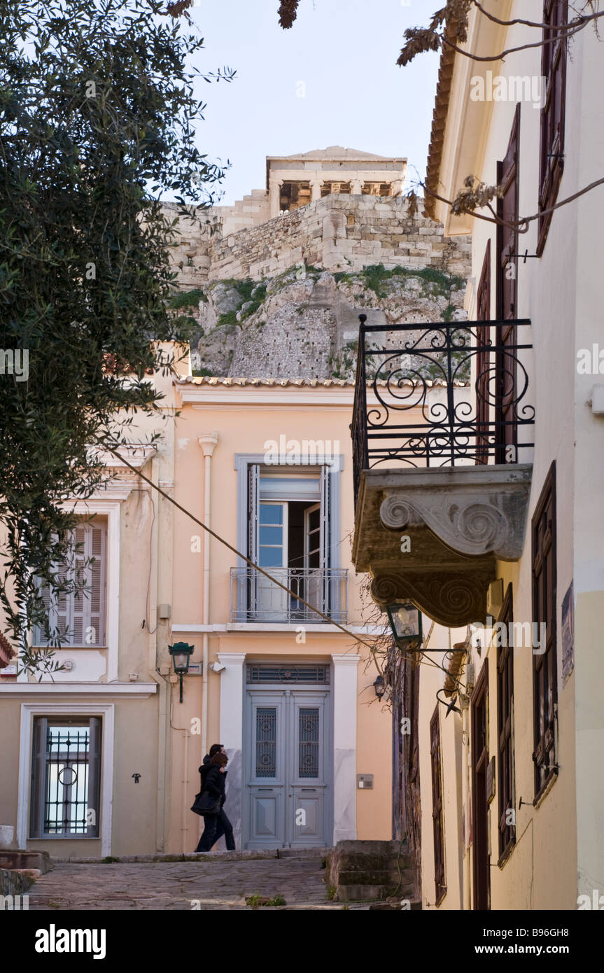 Looking up at the older 19th century houses to be found directly below the Acropolis in the Plaka district of Athens Greece Stock Photo