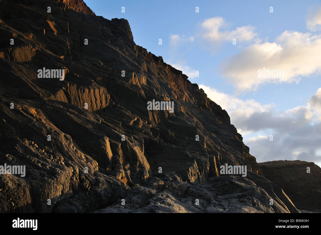 Coastal cliffs in the evening light Stock Photo