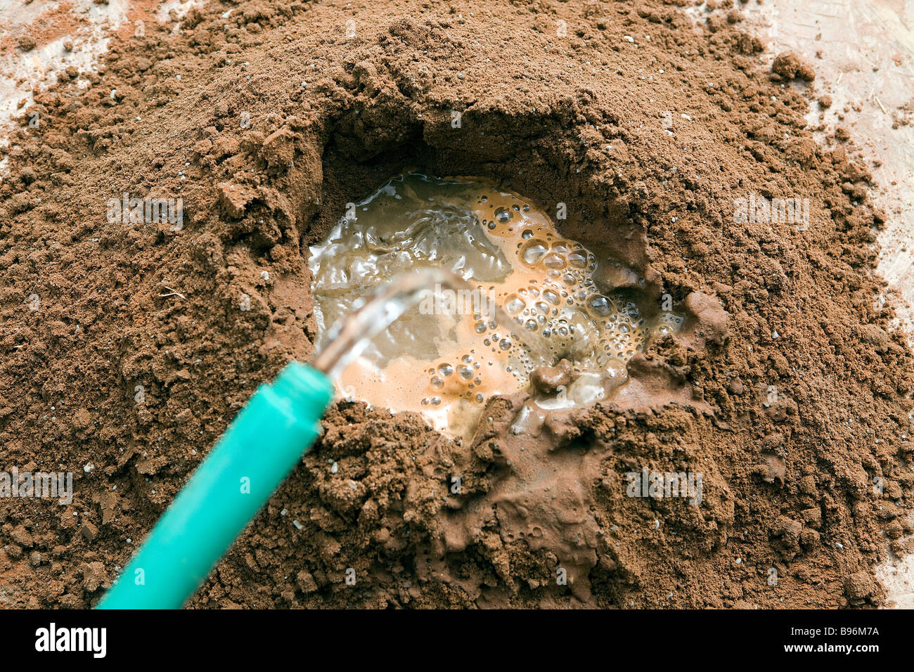 Sand and portland cement have been mixed together and water is added