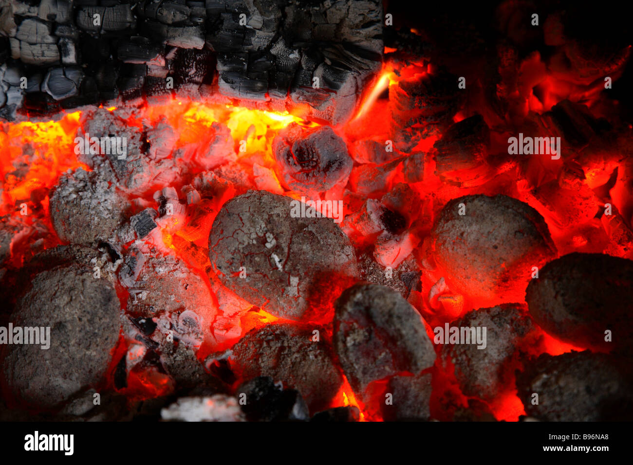 Red hot glowing coal and log fire Stock Photo Alamy