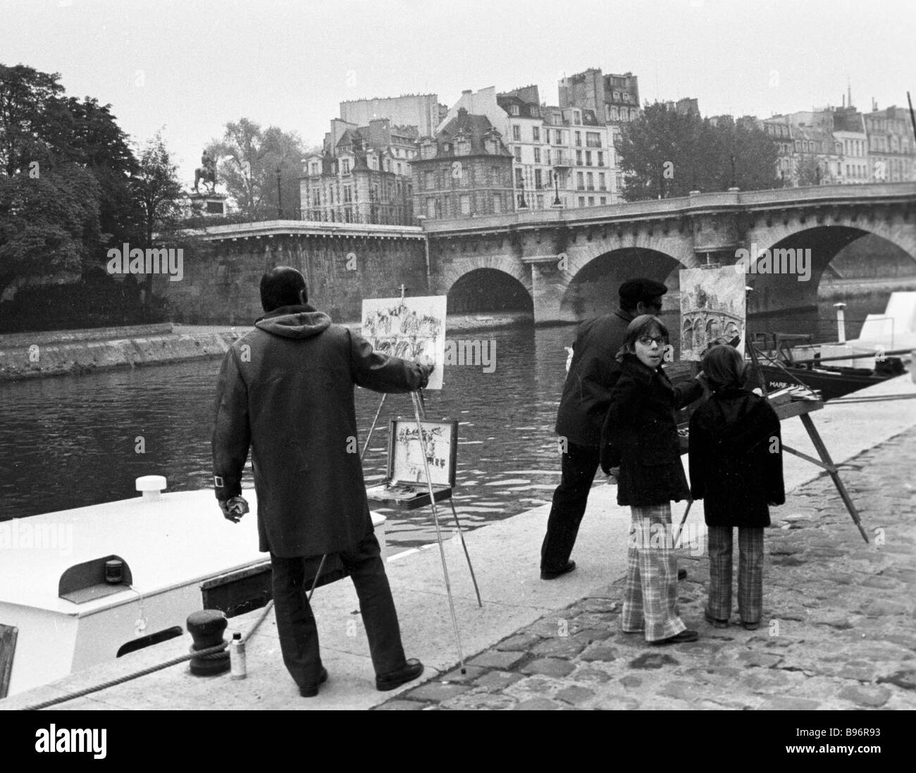 Painting a bridge in Paris Stock Photo