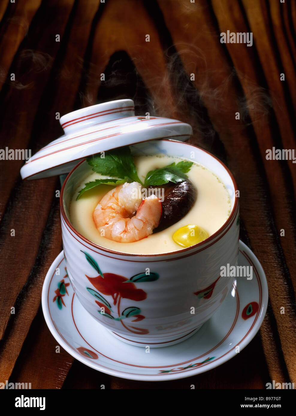 Savory steamed egg custard with assorted ingredients Stock Photo