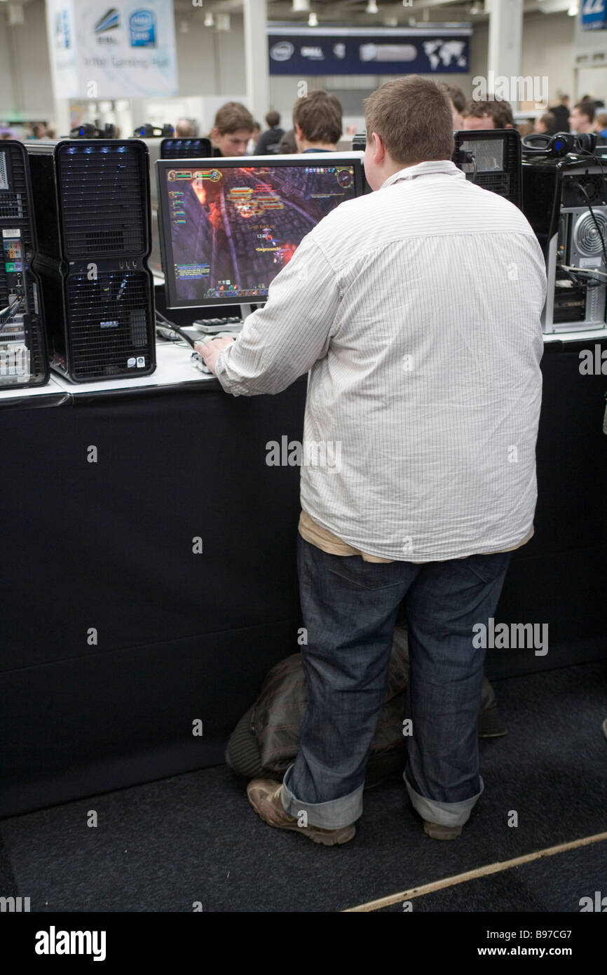 CeBIT heavily overweight teenager playing games at a computer Stock Photo