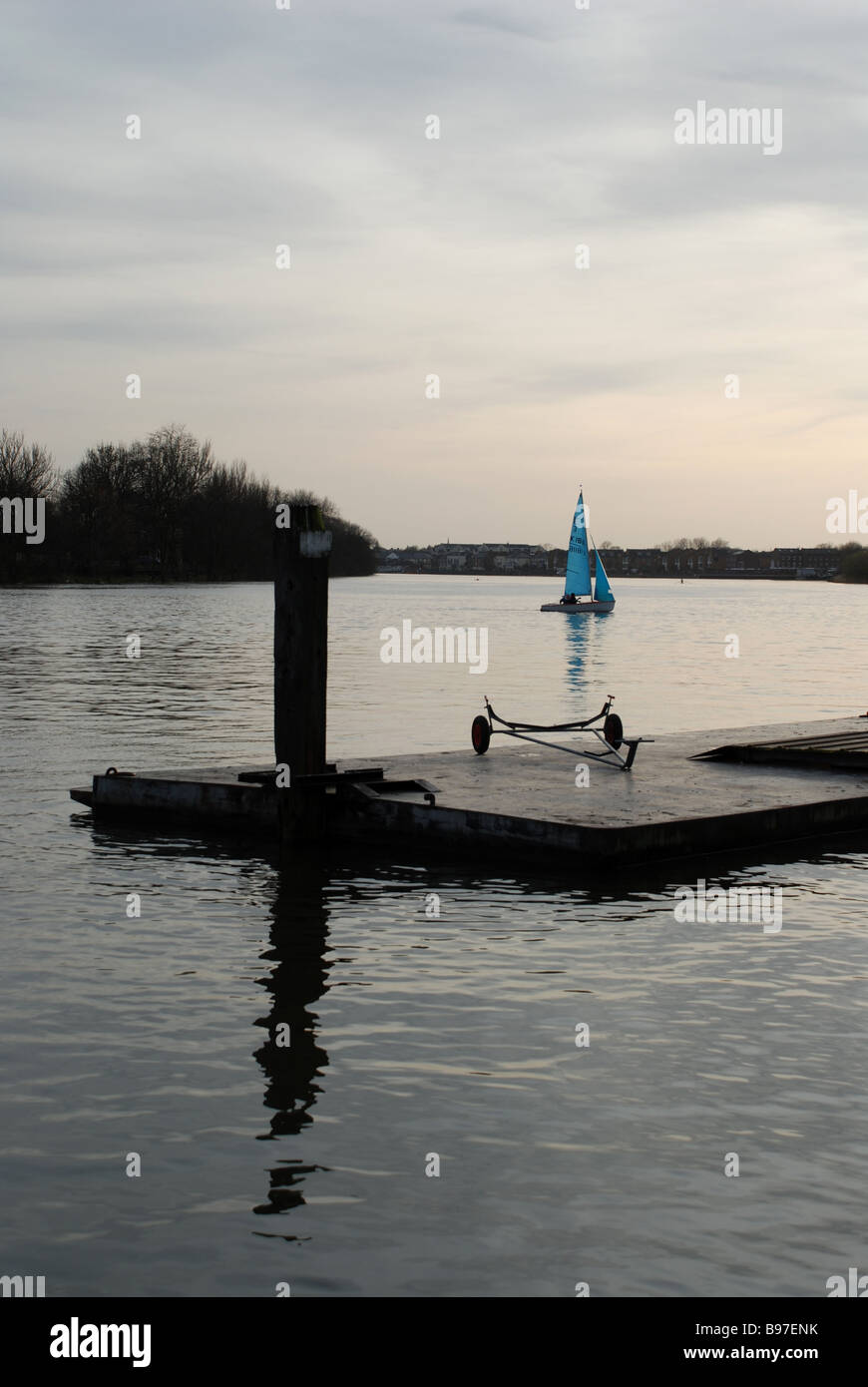 Sail boat on the Thames, near boat mooring, Hammersmith, London Stock
