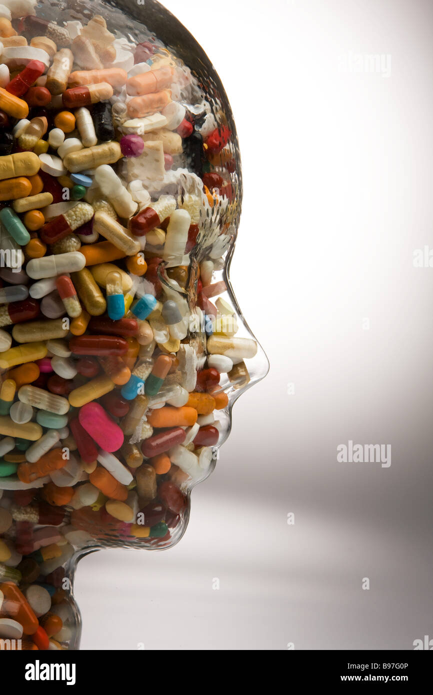 Tablets in a head made of glass Stock Photo Alamy