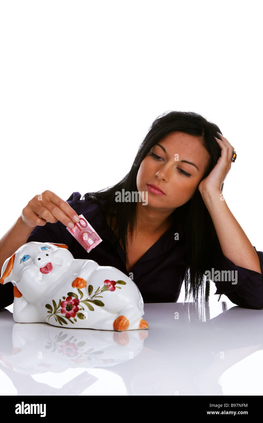 Young woman with piggy bank Stock Photo