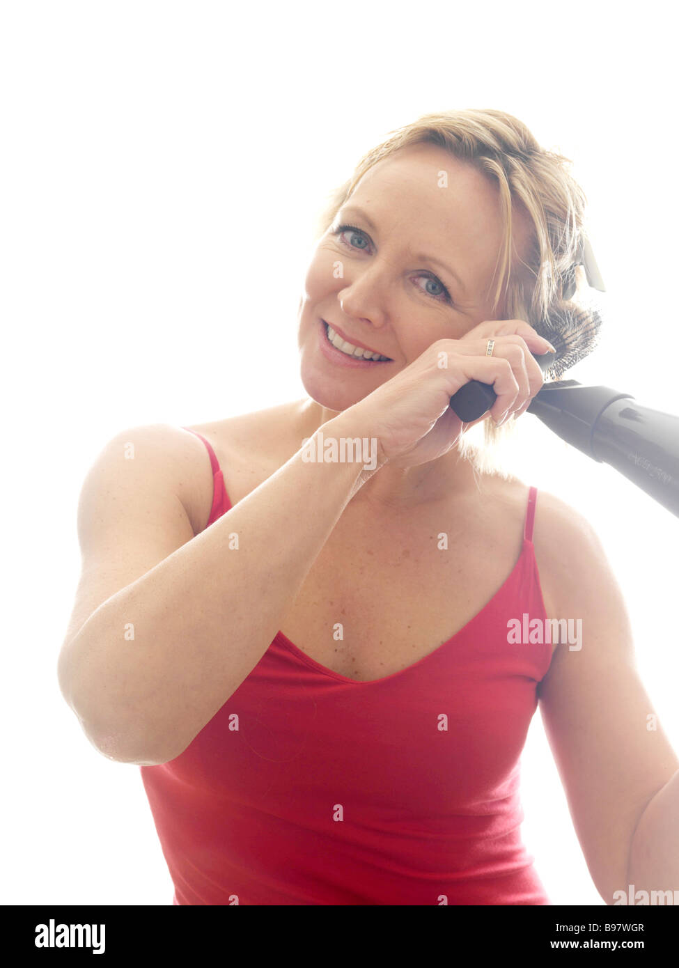 Mature woman hair brush dryer hi-res stock photography and images - Alamy