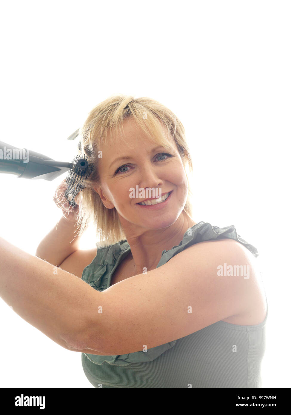 Mature woman hair brush dryer hi-res stock photography and images - Alamy