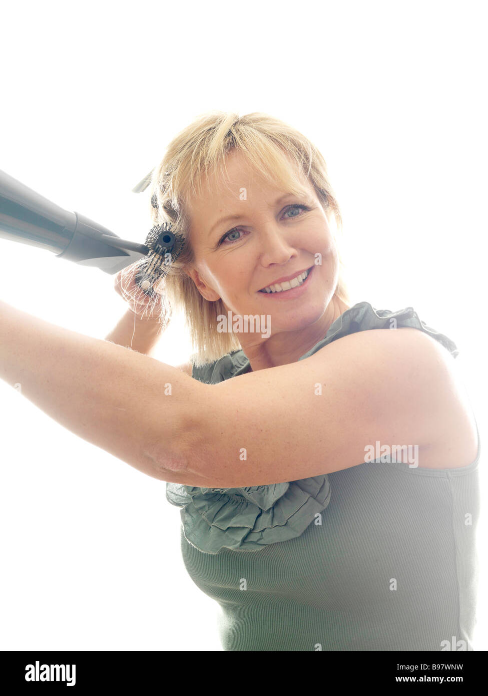 Mature woman hair brush dryer hi-res stock photography and images - Alamy
