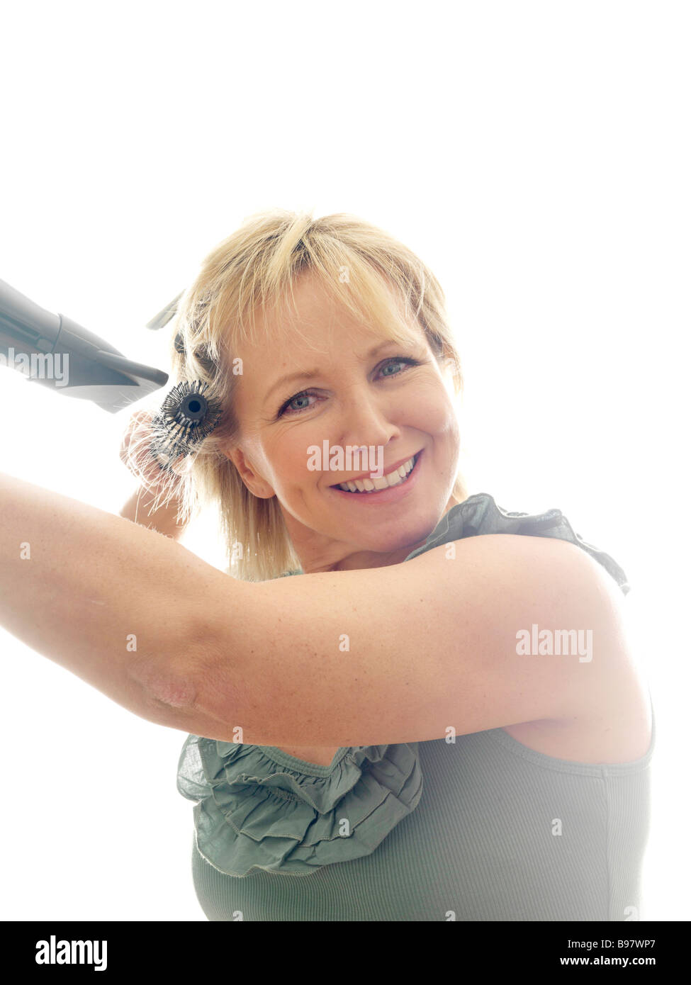 Mature woman hair brush dryer hi-res stock photography and images - Alamy