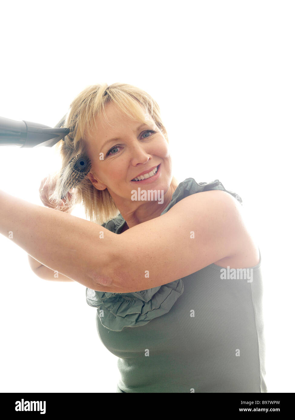 Mature woman hair brush dryer hi-res stock photography and images - Alamy